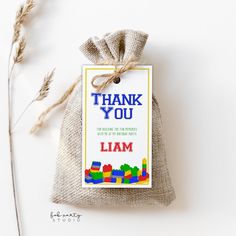 a small bag with a thank you tag attached to it