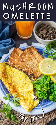 an omelette on a plate with lemons and parsley next to it