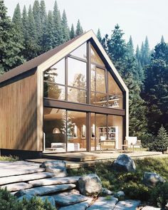 a small house in the woods surrounded by rocks