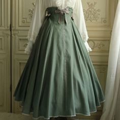 A high-waisted skirt with lace-up decoration on the side of the waist. Delicate lace embroidery is decorated along the front vertical line, around the waist, and around the hem. The fluffy silhouette is elegant and adorable. 
 
 

 

 
 
 ＜Item＞ 
 
 Long length 
 Middle length 
 
 
 ＜Size＞ 
 
 Long length
 
 S size
 
 Total length: 90cm 
 Waist: 60-74cm 
 
 
 M size 
 
 Total length: 90cm 
 Waist: 75-88cm 
 
 
 
 Middle length
 
 S size 
 
 Total length: 66cm 
 Waist: 60-74cm 
 
 M size 
 
 Tota Corset Ribbon, Ribbon Skirt, Ribbon Skirts, Skirt Long, Lace Embroidery, Gray Green, Long Length, Long Skirt, Green Dress