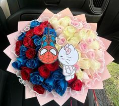 a bouquet of flowers in the back seat of a car with hello kitty on it