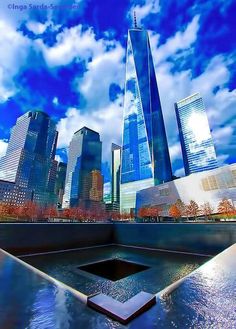 the world trade center and one world trade center in new york city, ny on a cloudy day