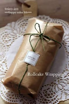 a wrapped present sitting on top of a doily