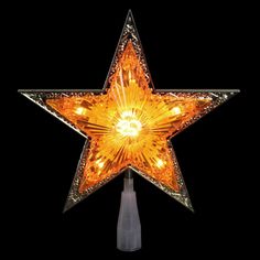 a lighted star on top of a pole