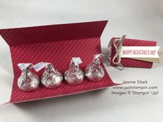 four hershey kisses in a red box with a happy valentine's day tag