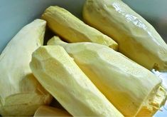 there are several pieces of peeled squash in the bowl