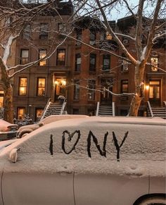 a car covered in snow with the word tony written on it