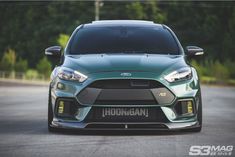 the front end of a green ford focus st