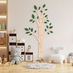 a child's room with a tree and teddy bear