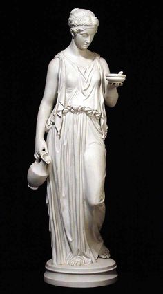 a white statue holding a bowl and a plate in it's hand, on a black background