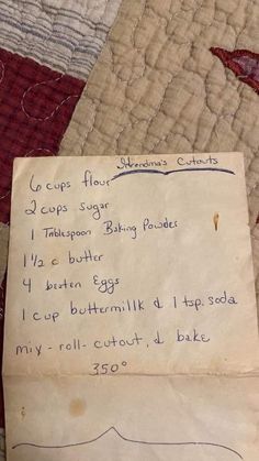 an old handwritten recipe from someone's grandmother on her quilted bedspread