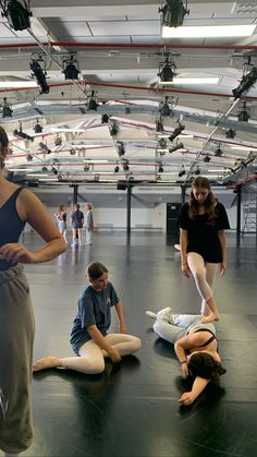 a group of people sitting on the floor in a room