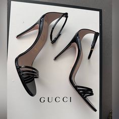 A Classic Silhouette, The Heeled Sandal Is Presented For The Latest Gucci Collection In Shiny Patent Leather. Ankle Closure With Adjustable Buckle And Leather Sole. Had Taps Replaced For More Stability. (New Taps Included With Heel) 3in Heel. Gucci Open Toe Heels With 4-inch Heel, Designer Ankle Strap Sandals With 4-inch Heel, Designer Sandals With Ankle Strap And 4-inch Heel, Classic Open Heel Sandals For Party, Chic Gucci Sandals With Single Toe Strap, Luxury Gucci Evening Sandals, Gucci Black Sandals With Single Toe Strap, Designer Black Sandals With Wrapped Heel, Designer Ankle Strap Sandals For Night Out