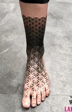 a person's foot with an intricate design on it