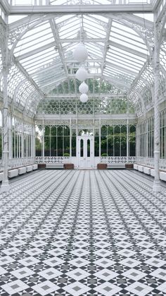 the inside of a white and black tiled building