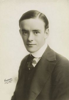 an old black and white photo of a young man