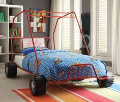 a child's bedroom with a metal bed frame