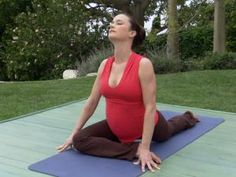 a pregnant woman is doing yoga outside