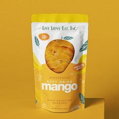 a bag of mango chips sitting on top of a table