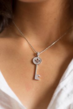 Cute key zirconium pendant, fleur de lys necklace, gift chain included French Symbol with historic meaning Perfect for birthday or anniversary gift First order with special surprise. ✨ D I M E N S I O N S✨ The diameter of the pendant is 13 mm and the total length of the pendant is 49 mm including the hook. The length of the chain is 42 cm. ✨ V A R I A T I O N S✨ We also have a circle fleur de lys pendant with zirconium on the following link: https://www.etsy.com/listing/574934823/ ✨WHAT INCLUDES French Symbols, Filigree Necklaces, Sunflower Necklace, Symbol Necklace, Key Pendant, Circle Pendant, Gold Filled Jewelry, Silver Pendant, Silver Fashion