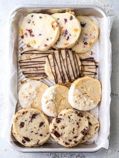 a tray filled with cookies and other desserts