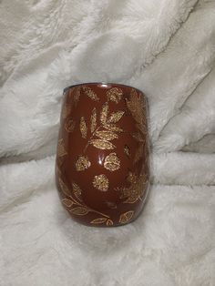 a close up of a wine glass on a white blanket