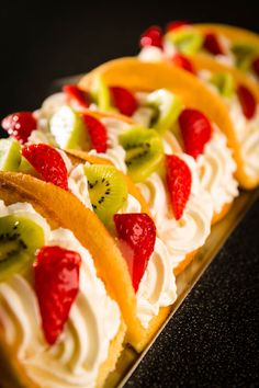 dessert tacos with kiwis, strawberries and kiwi slices on top