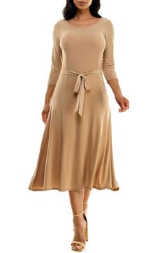 A twirl-worthy, tea-length skirt brings an elegant balance to a solid work-to-weekend dress fashioned from a stretch jersey for a sensible fit. 48" length Bateau neck Three-quarter length sleeves Waist belt 95% polyester, 5% spandex Machine wash, tumble dry Imported Model stats: 5'10" height, 32" bust, 25" waist, 36" hip. Model is wearing size Small. Beige Stretch Midi Dress, Stretch Midi Dress For Formal Occasions, Fall Midi Dress In Elastane, Flattering Stretch Midi Dress, Stretch A-line Midi Dress For Work, Spring Workwear Stretch Maxi Dress, Solid Color Elastane A-line Dress, Fit And Flare Midi Dress In Elastane, A-line Stretch Maxi Dress For Work