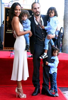 the actor and his wife are posing with their children on the hollywood walk of fame