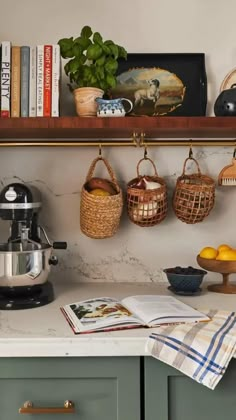 the kitchen counter is clean and ready to be used as a coffee maker, lemons, books, and other items