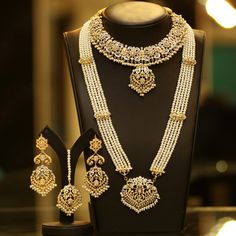 A versatile set encrusted with zircon stones and pearl moti. The set includes a pair of beautiful earrings, tikah and male and rani haar. Gold-plated on high-quality brass as base metal. Approximate earrings length is 3.5″. Luxury Meenakari Temple Jewelry Pearl Necklace, Lily Lamp, Hyderabadi Jewelry, Nontraditional Engagement Rings, Pakistani Jewellery, Beauty Movie, Bridal Jewelry Sets Brides, Nikah Dress, Bride Jewelry Set