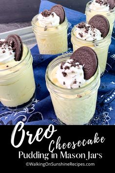 oreo cheesecake pudding in mason jars on a blue cloth with the words oreo cheesecake pudding in mason jars