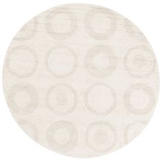 a white rug with circles on it