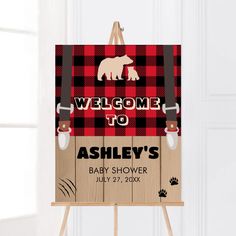 a welcome sign for a baby's shower with an image of a bear on it