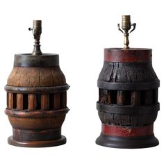 two wooden lamps with metal fittings on them