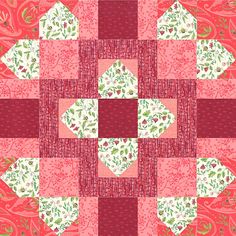 a red and pink quilt with an intricate design