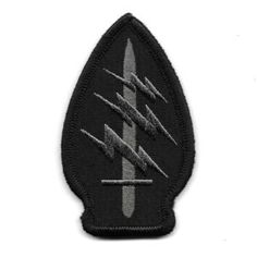 a black and grey patch with two knives on it