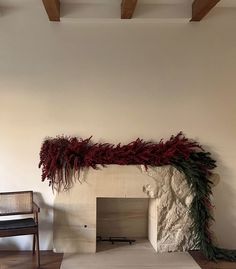 a living room with a fire place and chair