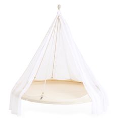 a white hanging bed with mosquito netting on it's sides and an open canopy over the top