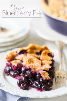 a slice of blueberry pie on a white plate