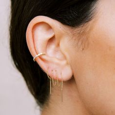 Solid 14K gold chain earring threader can be worn simply through one hole, or looped in between all your piercings to give a one of a kind look. This piece has no limitations and feels barely there. Length: 5.5" Sold as a single 14k Gold Threader Earrings For Everyday, Dainty 14k Gold Ear Cuff For Everyday, 14k Gold Dangle Cartilage Earrings For Everyday, 14k Gold Dangle Cartilage Earrings, Dainty Yellow Gold Ear Cuff For Everyday, Everyday 14k Gold Single Ear Climber, Everyday Minimalist 14k Gold Ear Cuff, Yellow Gold Threader Earrings For Everyday, 14k Gold Ear Climbers For Everyday