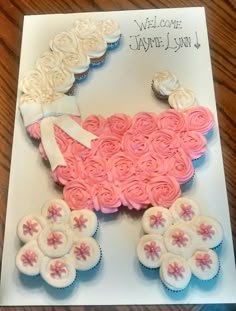 a card with cupcakes in the shape of a sheep and flowers on it