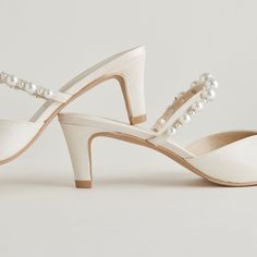 Just in time for wedding season. KANIKA is a dream in pearls, and perfect for all day and night wear. Whether you're a guest or are tying the knot yourself, these are THE must-have shoes for any event. Textile + Pearl Upper Recycled Synthetic Outsole Water-based Leather Alternative Lining Leather Sock 2.3" Heel Height Imported Formal High Heel Pearl Wedding Shoes, Elegant Pearl Heels For Evening, Formal Pearl High Heel Wedding Shoes, Formal Pearl Wedding Shoes High Heel, Evening Closed Toe Pearl Wedding Shoes, Formal Closed Toe Pearl Heels, Evening Wedding Shoes With Pearl And Closed Toe, Pearl Wedding Shoes With Round Toe For Formal Occasions, Pearl Wedding Shoes With Round Toe