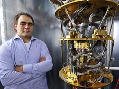 a man standing in front of a machine with many wires on the top and bottom