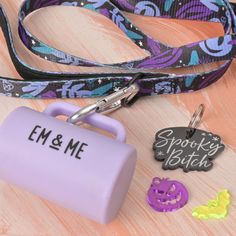 an em & me keychain, lanyard and other items on a table