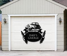 a garage with a sign that says dad's garage