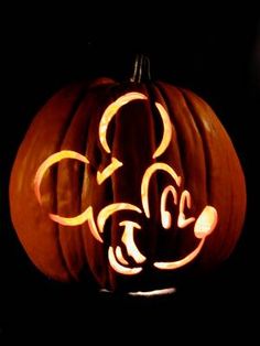 a carved pumpkin with the letter c on it