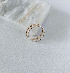 This unique textured ring band will be handmade to order in your size. Each ring is made with the long oval beads that are connected to the spacer beads creating an eye catching intricate detail. Wear this band on its own, stack with other bands or use as a spacer ring. DETAILS Band width: 1.3mm 14k gold filled or Sterling silver Simple Design Toe Ring Stackable Rings For Promise, Simple Design Stackable Promise Toe Rings, Dainty Stackable Bands For Promise Ring, Delicate Stackable Toe Rings, 14k Gold Filled Yellow Gold Toe Ring, 14k Gold Filled Rose Gold Round Band Jewelry, 14k Gold Filled Rose Gold Ring, 14k Rose Gold Filled Round Band Jewelry, Dainty 14k Gold Toe Ring