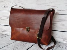 Gorgeous, medium-sized distressed brown crossbody bag.  Made with a high quality brown pull-up leather: the waxy finish gives that sought-after antique effect. Brown leather strap, with buckle for adjusting the length.  Natural suede interior and attractive swing arm clasp.  Simple yet elegant.  ***Dimensions***  Width/Height/Depth: 32(top)x22x7cm  If you have any questions please let me know.  Have a great day Classic Crossbody Shoulder Bag With Single Strap, Classic Clutch Shoulder Bag With Adjustable Strap, Classic Crossbody Satchel With Single Strap, Classic Crossbody Satchel, Classic Crossbody Satchel With Single Shoulder Strap, On-the-go Soft Leather Crossbody Shoulder Bag, Classic Travel Satchel With Single Shoulder Strap, Classic Single Strap Crossbody Satchel, Leather Satchel With Adjustable Handle