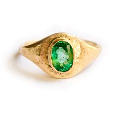 The Emerald Signet engagement ring is a truly special ring, hand formed and heavily hammered gold glittering like treasure around the bright green stone, at once opulent and organic with an ancient feel. The substantial .75 carat emerald measures 6x4mm, and is set low in a hand-formed 14k recycled yellow gold bezel. The signet profile tapers from 9mm on the topside of the ring to a slim 2mm on the underside, perfect for everyday wear. Emerald Signet | Emerald Signet Engagement Ring Hammered 14k Signet Engagement Ring, Signet Engagement Rings, Special Ring, Ring Hand, Hammered Gold, Perfect Engagement Ring, Green Stone, Quartz Stone, Perfect Ring